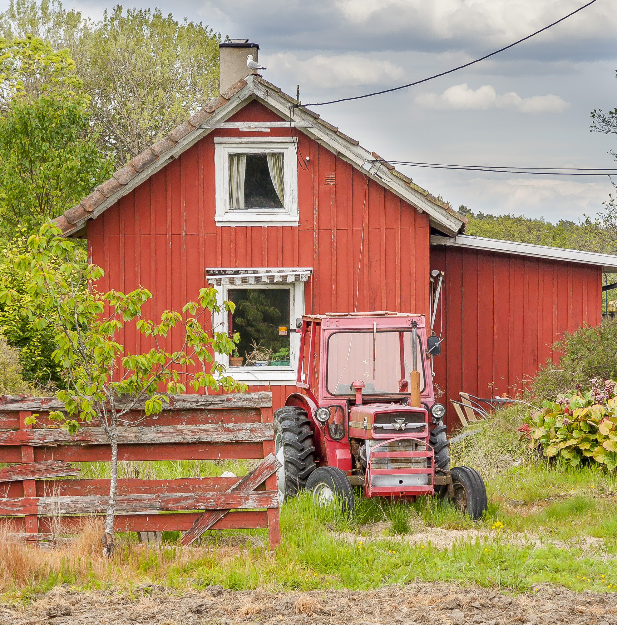 Red house and tractor in Hvaler from Norway Viken Hvaler